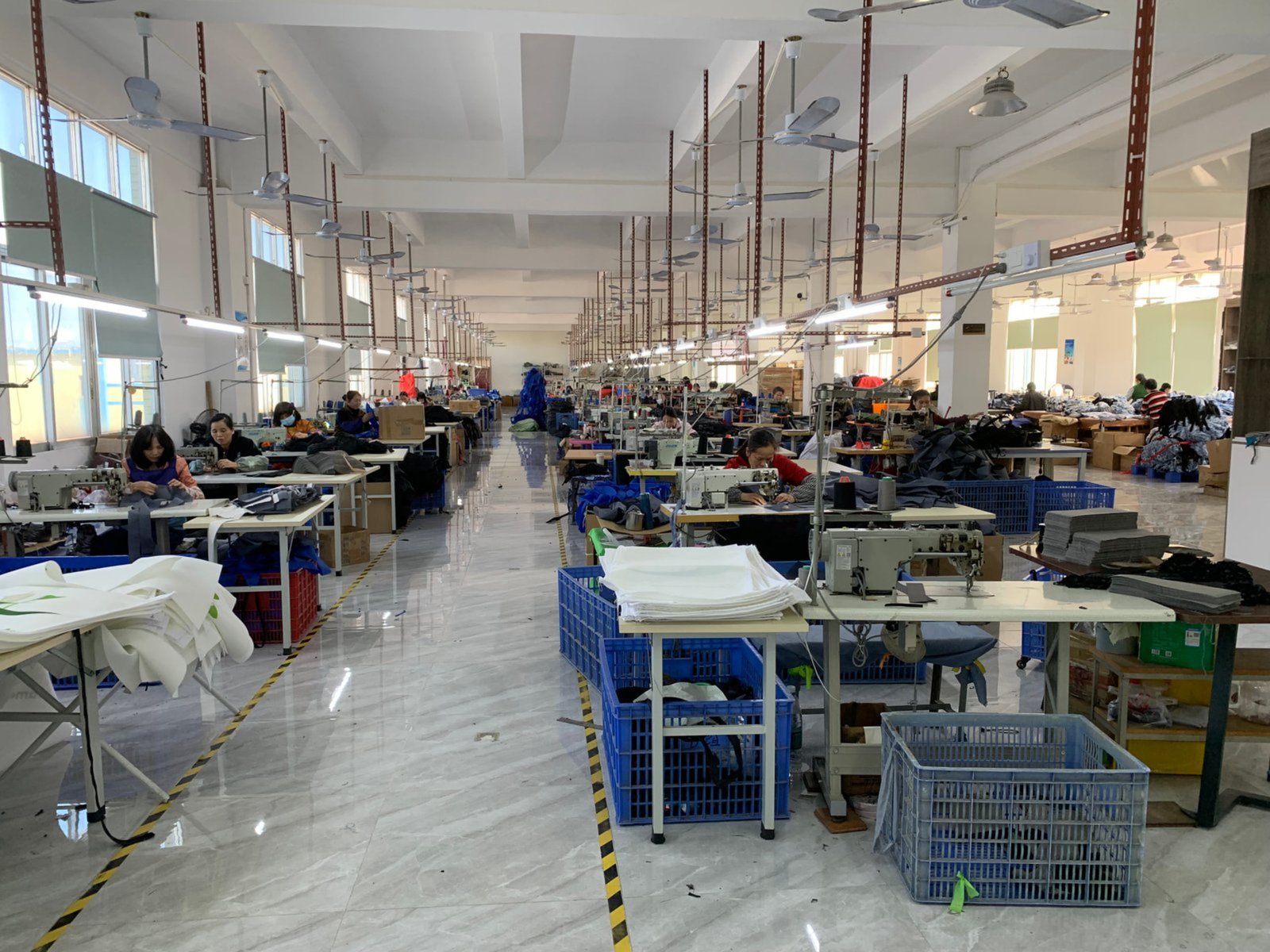ZRC factory floor showing 50+ industrial sewing machines across 3 production lines