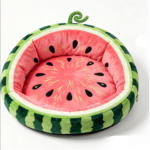 CW114 watermelon round cat bed in a realistic pet-use scene